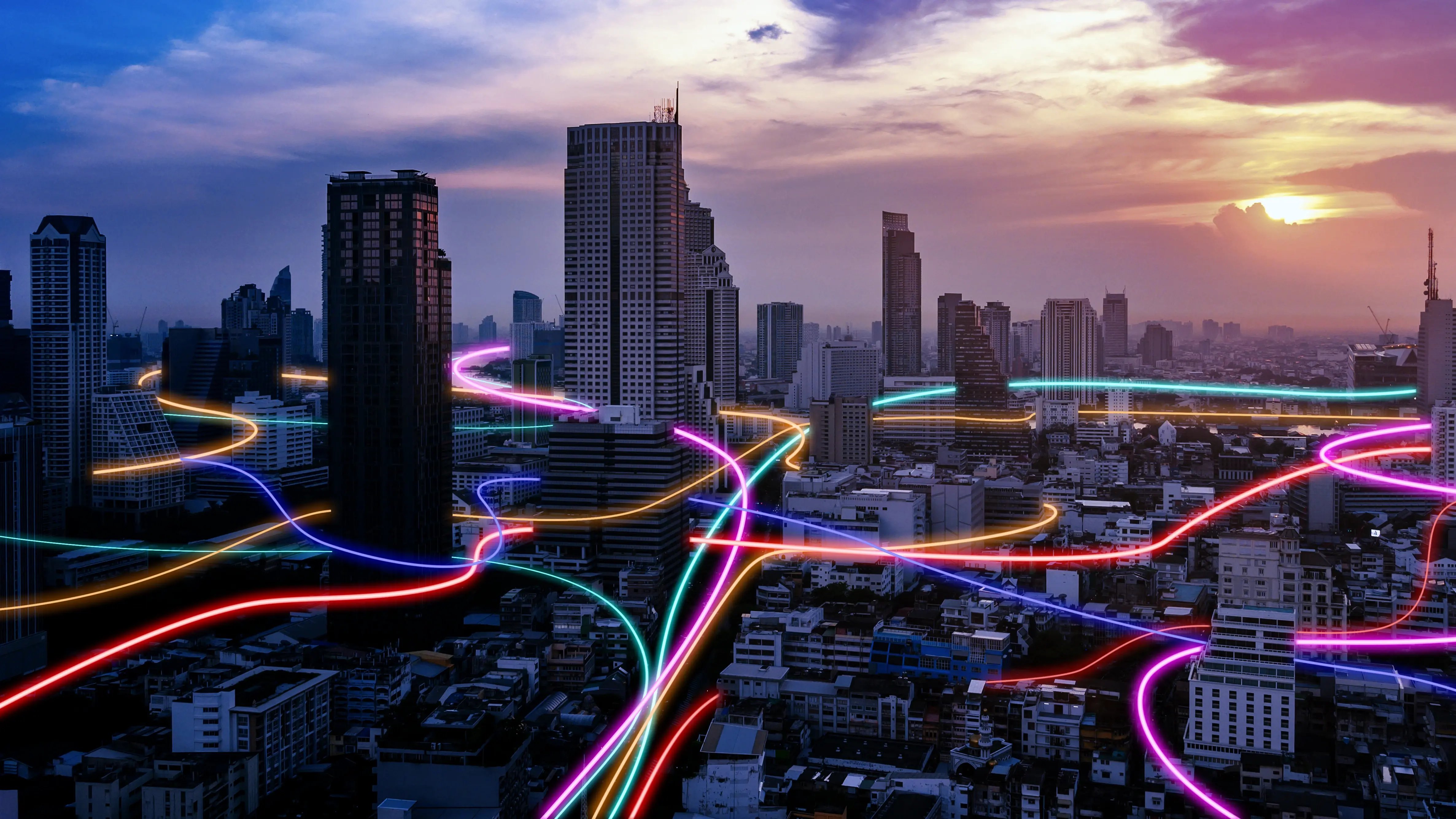 Eine moderne Stadt. Digitalisierung wird stark betont und durch bunte Leuchtstrahlen visualisiert.
